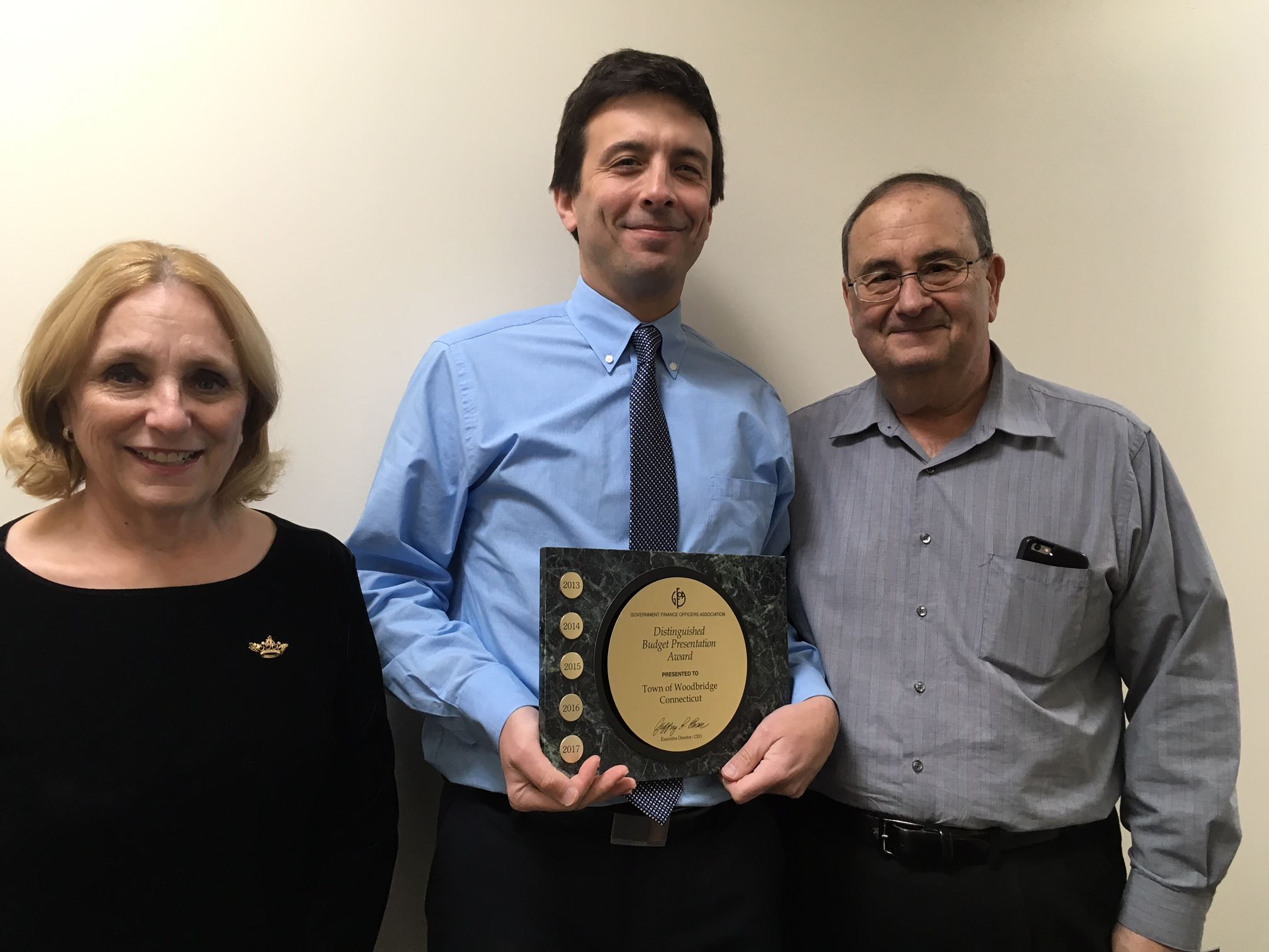 Beth Heller, Tony Genovese and Matt Giglietti with GFOA award